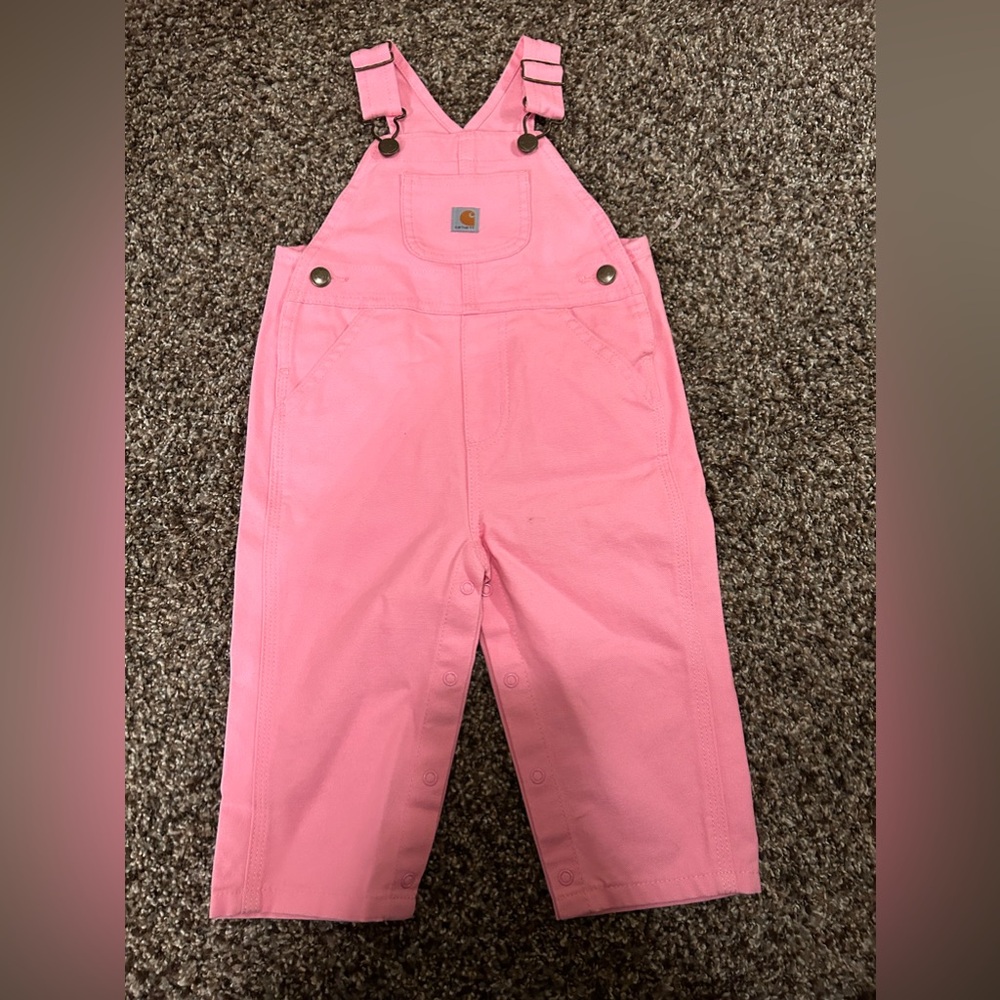 Brand new pink overalls for babies.